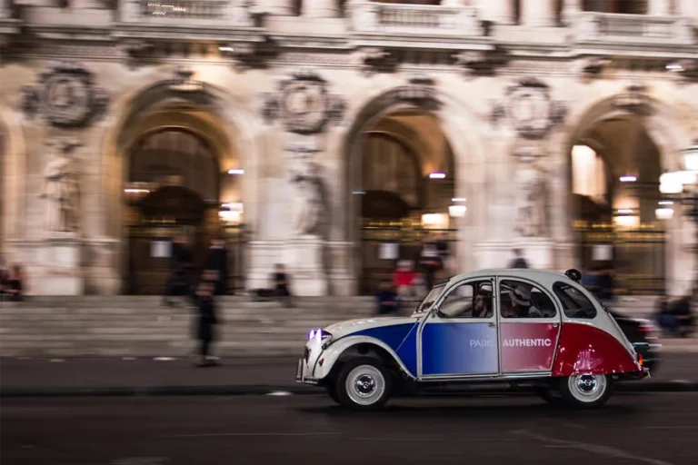 Paris: Discover Paris by night in a vintage car with a local