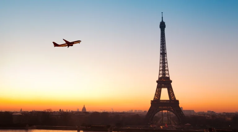 Airplane passing near the Eiffel Tower