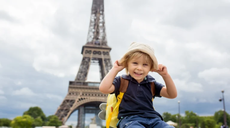 Child in front of the Eiffel Tower