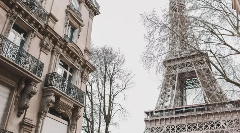Eiffel Tower in front of the windows of a hotel