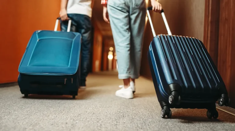 Tourists in hotels walk with trolleys